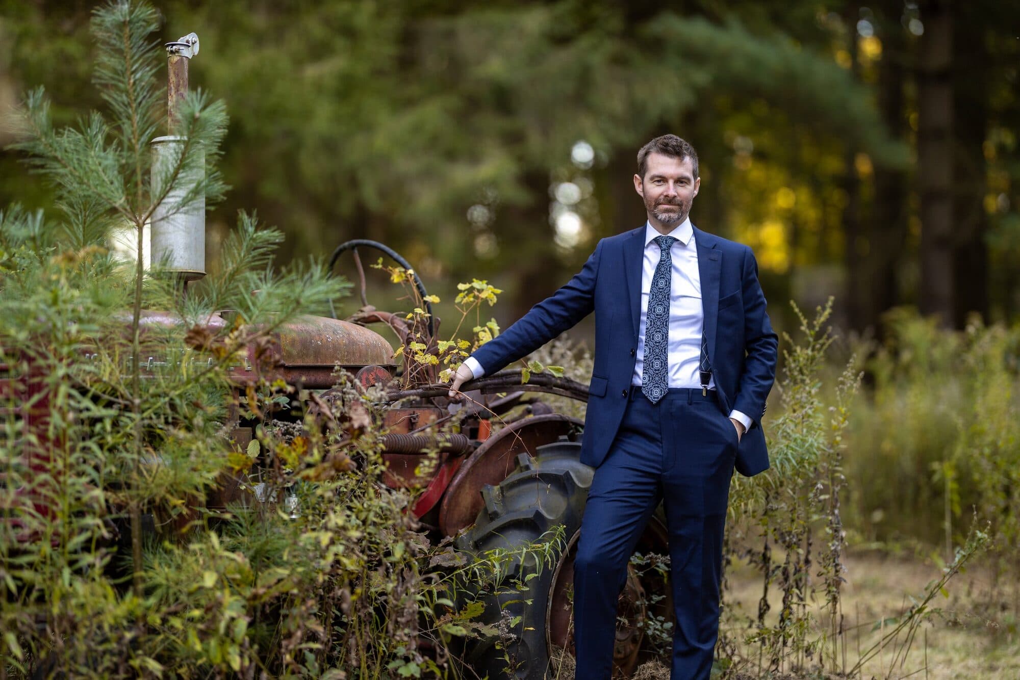 Couple walking through golden light at Fernwood Hills near London, Ontario